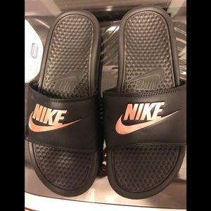 Like new rose gold Nike slides